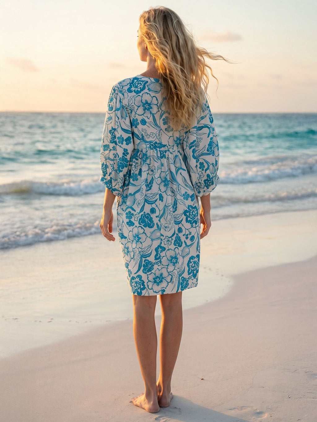 Amber Blouse Dress Blue Dress Women standing in the Beach with Sunset back view.